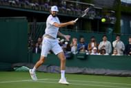 Reilly Opelka in action at The Championships - Wimbledon 2022.